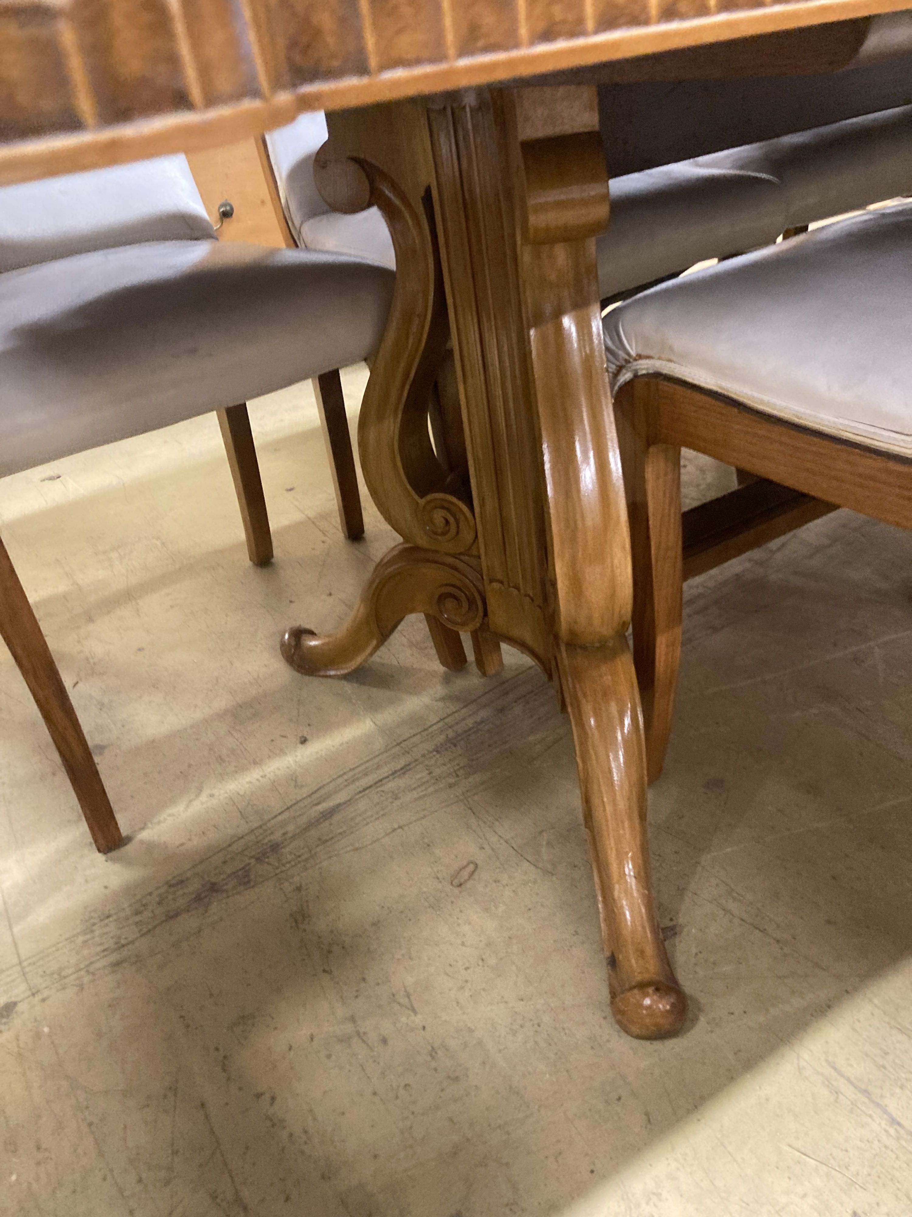 A mid century birds eye maple and walnut dining suite, comprising extending table, 205cm, depth 106cm, height 76cm, a set of ten dining